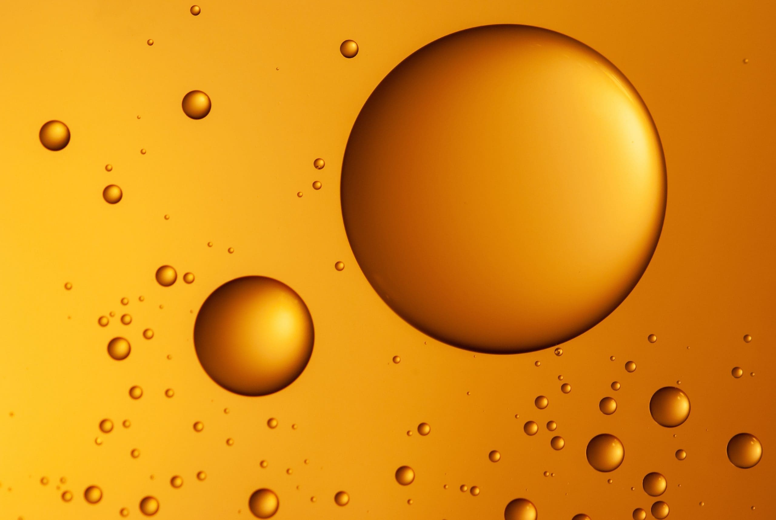 Abstract Background With Water Drops On The Glass. The Concept Of A Natural Cosmetic Product Serum And Gel.