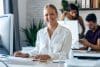 Beautiful Business Woman Working With Computer While Smiling Loo