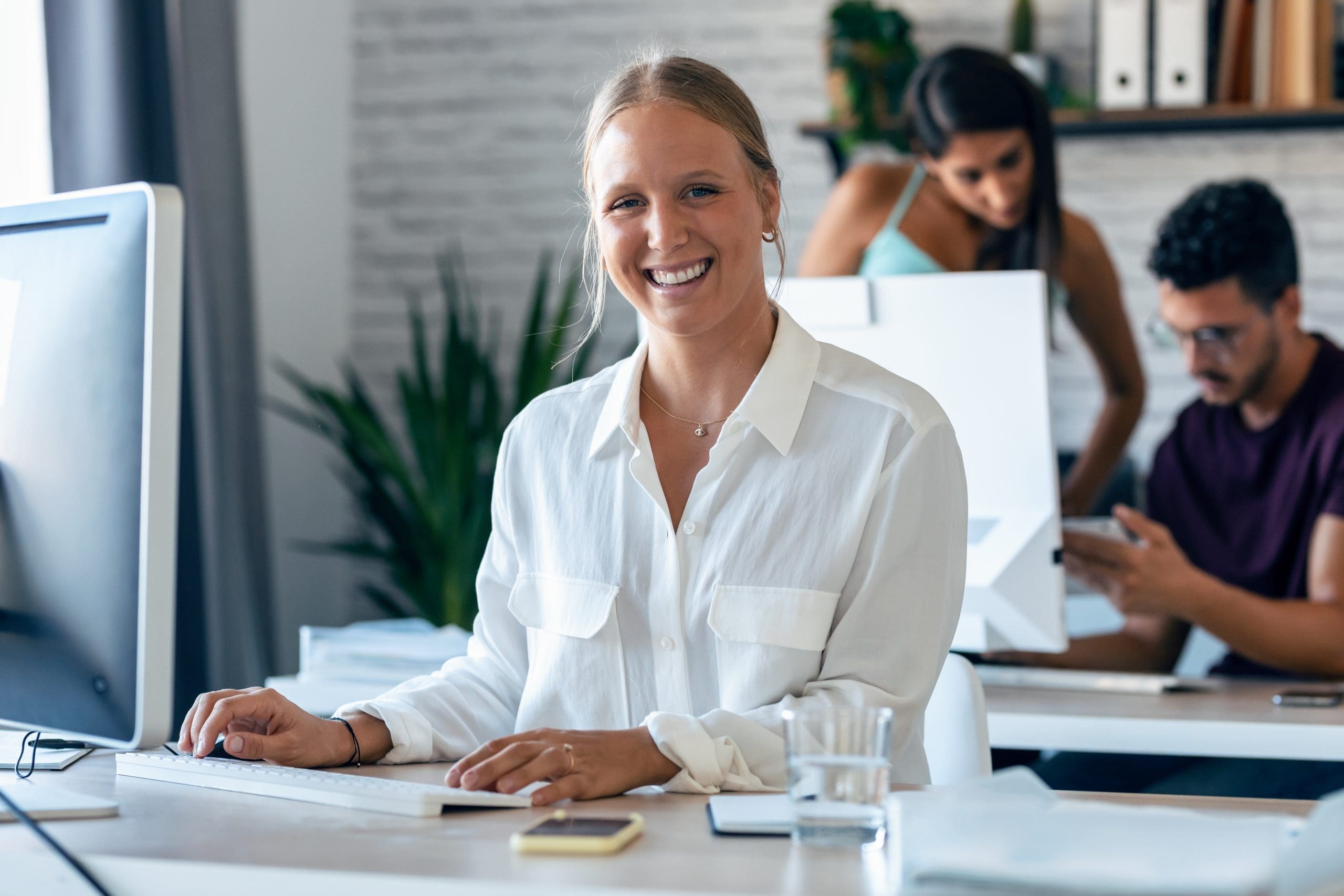 Beautiful Business Woman Working With Computer While Smiling Loo