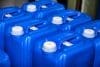 Close Up Of Some Liquid Cans Stands On Warehouse Storage Of Chemical Liquids