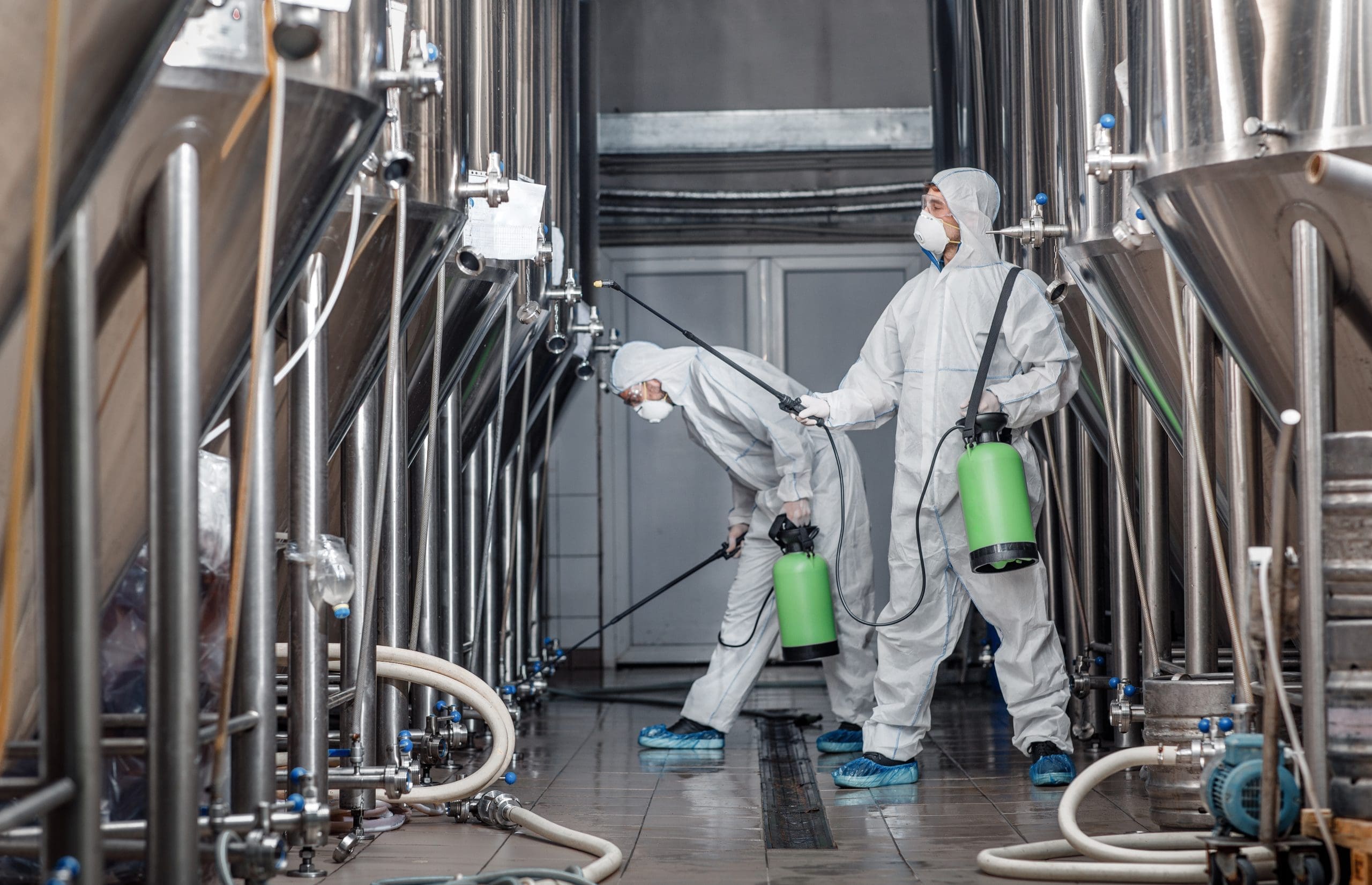 Craft Brewery, Eco Product And Disinfection. Workers In Hazmat Suits Clean Plant
