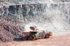 Eath Mover Loading Stones On A Dumper Truck
