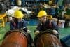 Engineer In The Process Of Inspecting Train Engines Keep The Mac