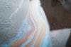Gasoline Multicolored Stain, Spilled Oil In Puddle On Asphalt, Environmental Pollution