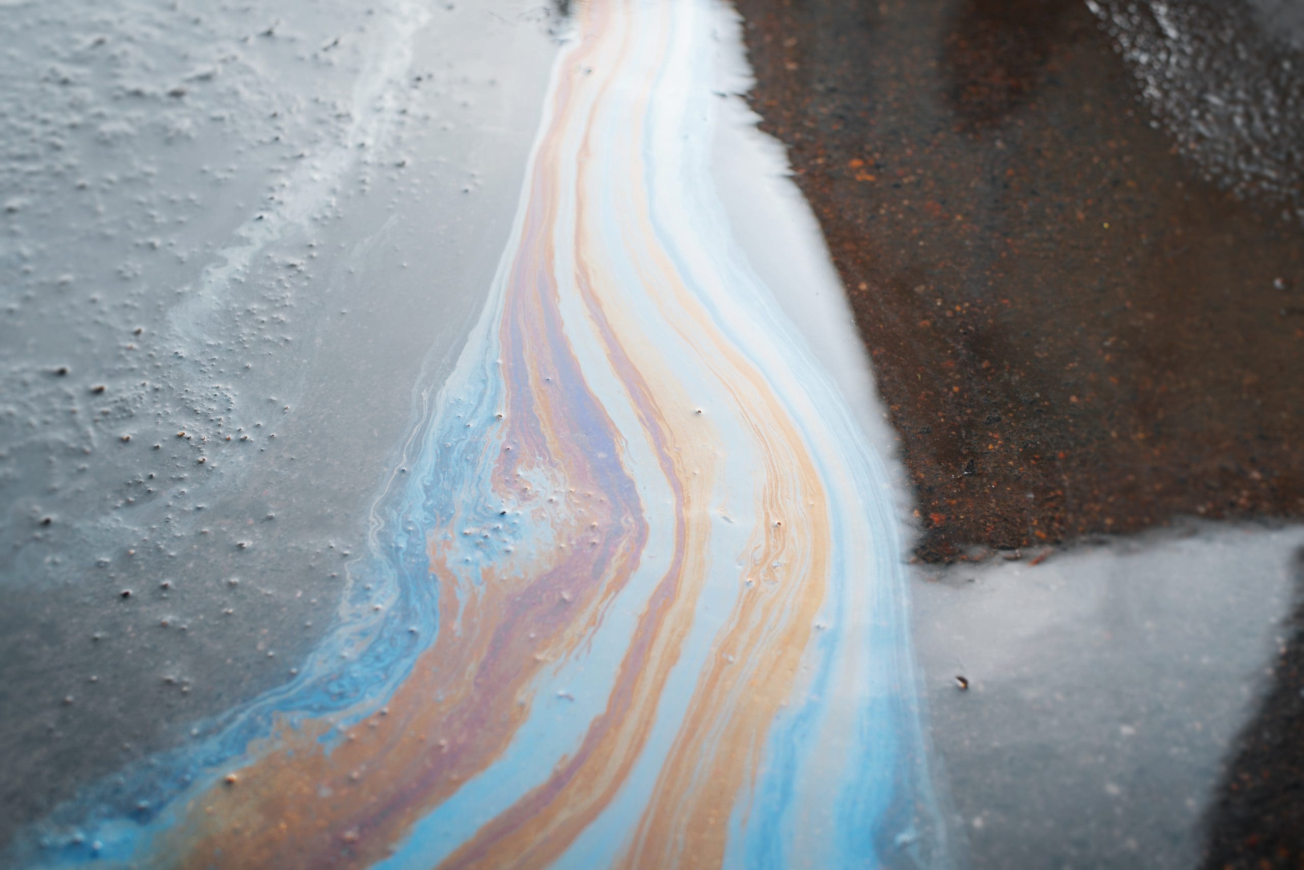 Gasoline Multicolored Stain, Spilled Oil In Puddle On Asphalt, Environmental Pollution