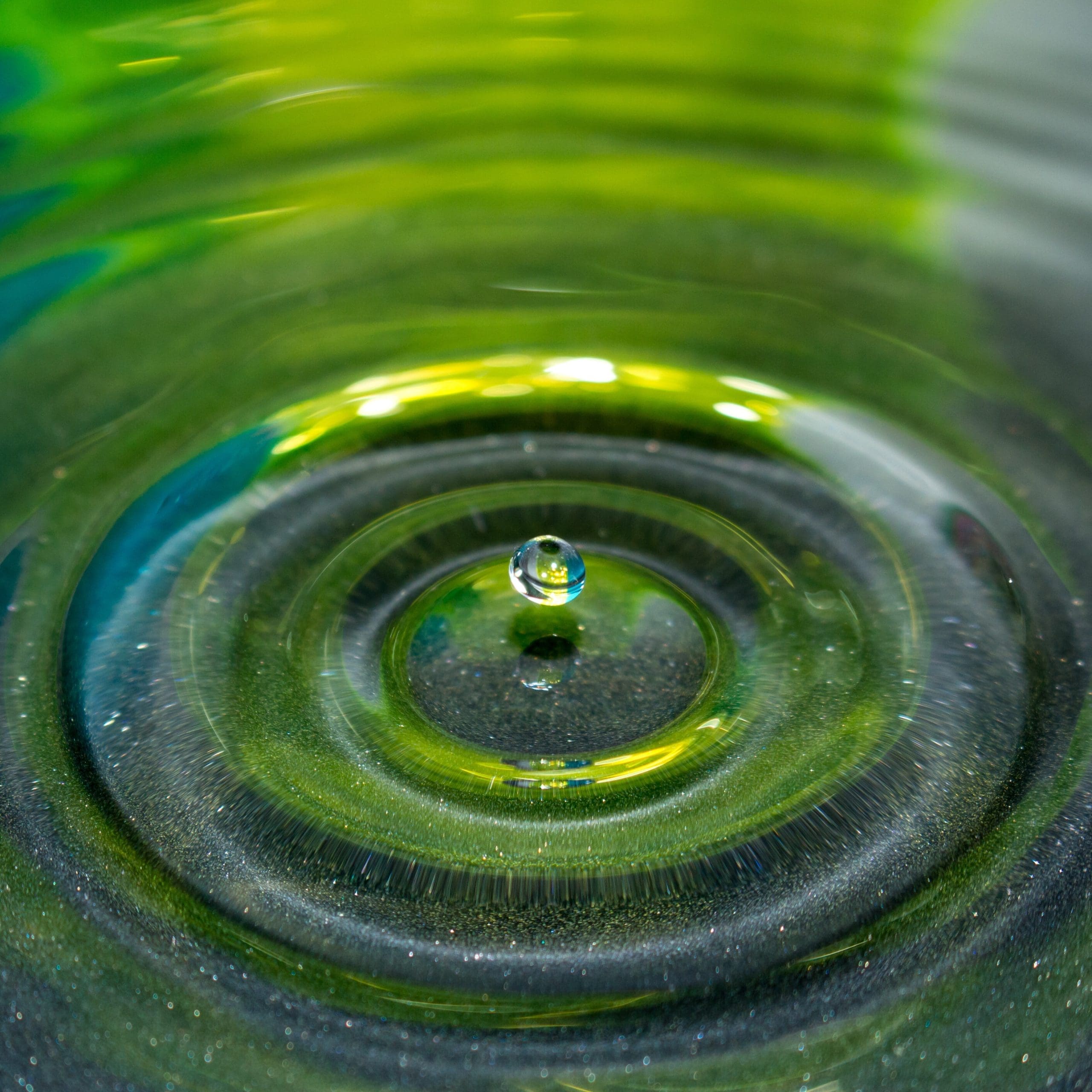 Macro Shot Of A Tiny Water Droplet Falling Into Gr 2024 11 29 10 14 51 Utc