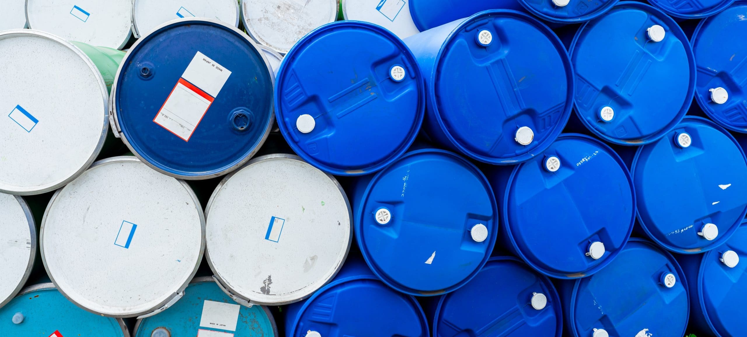 Old Chemical Barrels. Blue And Green Oil Drum. Steel And Plastic