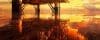 A Panoramic View Of An Offshore Oil Rig Drilling Platform Against The Backdrop Of A Vibrant Sunrise.