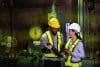 The Engineer Consult Manager Looks At The Digital Tablet Checking Maintenance Part For Outage