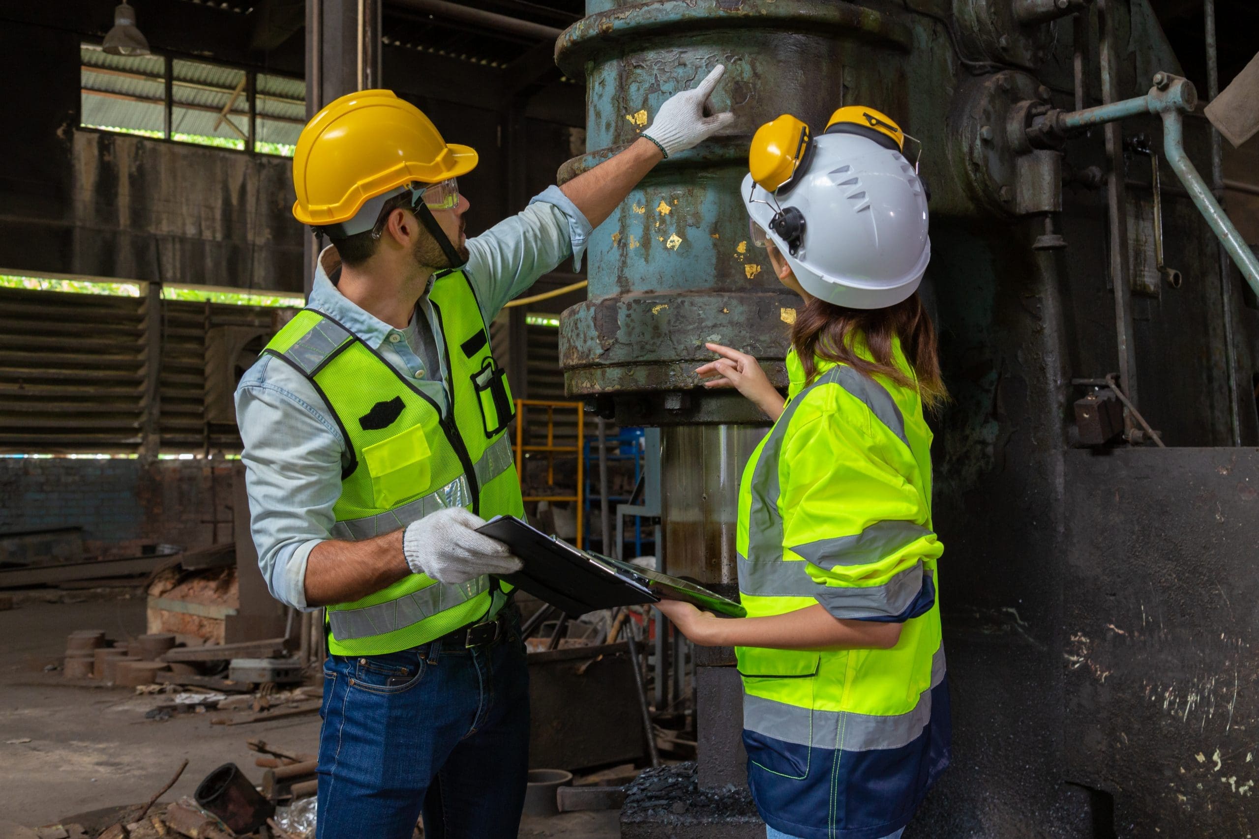 Two Engineers In A Steel Mill Consult The Size Of The Steel Work
